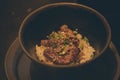 Grilled foie gras on top rice in black bowl Royalty Free Stock Photo