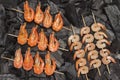 Grilled food. Charcoal skewers shrimps and tiger prawns