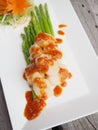 Grilled fresh scallop with x.o. red sauce Chinese style.
