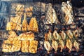 Grilled fresh seafood: prawns, fish, octopus, oysters food background Barbecue / Cooking BBQ food on fire Royalty Free Stock Photo