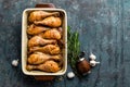 Grilled fried roast chicken legs, drumsticks on dark background, meat with ingredients for cooking Royalty Free Stock Photo