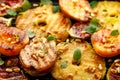 Grilled fruits; pineapples, peaches, figs, pears and watermelon with pine nuts, fresh herbs and honey on the grill plate, top view