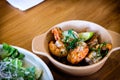 Grilled Gambas al Ajillo, Spanish chilli-and-garlic shrimp, served on a wooden table