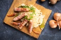 Grilled german sausage links with sauerkraut