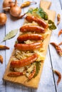 Grilled german sausage links with sauerkraut