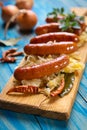 Grilled german sausage links with sauerkraut