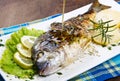 Grilled gilt head sea bream on plate