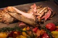 Grilled goat with vegetables and spices on a cutting Board Royalty Free Stock Photo