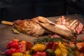 Grilled goat with vegetables and spices on a cutting Board Royalty Free Stock Photo