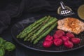 Grilled green asparagus and salmon with beetroot gnocchi