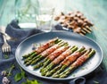 Grilled green asparagus wrapped with bacon