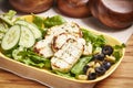 Grilled Halloumi Cheese with olive, salad and cucumber served in dish isolated on table side view of middle east food Royalty Free Stock Photo