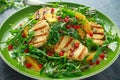 Grilled Halloumi Cheese salad with orange, rocket leaves, pomegranate and pumpkin seed. healthy food Royalty Free Stock Photo