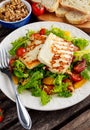 Grilled Halloumi Cheese salad witch orange, tomatoes and lettuce. healthy food Royalty Free Stock Photo