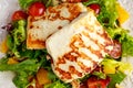 Grilled Halloumi Cheese salad witch orange, tomatoes and lettuce. healthy food Royalty Free Stock Photo