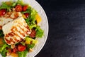 Grilled Halloumi Cheese salad witch orange, tomatoes and lettuce. healthy food Royalty Free Stock Photo