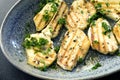 Grilled Haloumi Cheese in Bowl topped with parsley Royalty Free Stock Photo