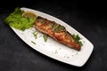 Grilled mackerel with herbs on a plate