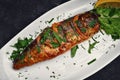 Grilled mackerel with herbs on a plate