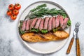 Grilled Homemade rib eye Steak sandwich with sliced roast beef, arugula. White background. Top view Royalty Free Stock Photo