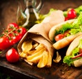 Grilled hot dogs on a picnic wooden table