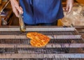 Grilled Japanese Senbei on a stove Royalty Free Stock Photo