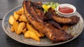 Grilled juicy barbecue pork ribs in a white plate with fries and parsley and vegetarian salad. Royalty Free Stock Photo