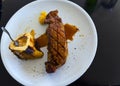 Grilled juicy Sirloin steak with potatoes on a white plate