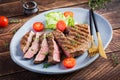 Grilled juicy steak medium rare beef with spices Royalty Free Stock Photo