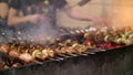 Grilled kebab cooking on metal skewer closeup. Roasted meat cooked at barbecue. BBQ fresh beef meat chop slices Royalty Free Stock Photo