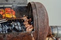 Grilled kebab cooking on metal skewer closeup. Roasted meat cooked at barbecue. BBQ fresh beef meat chop slices