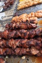 Grilled kebab cooking on metal skewer. Roasted meat cooked at barbecue. BBQ fresh beef meat chop slices Royalty Free Stock Photo