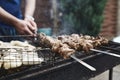 Grilled kebab cooking on metal skewer. Roasted meat cooked at barbecue. BBQ fresh beef meat chop slices. Traditional Royalty Free Stock Photo