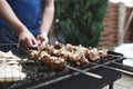 Grilled kebab cooking on metal skewer. Roasted meat cooked at barbecue. BBQ fresh beef meat chop slices. Traditional Royalty Free Stock Photo