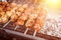 Grilled kebab cooking on metal skewer. Roasted meat cooked at barbecue. BBQ fresh beef meat chop slices. Traditional eastern dish, Royalty Free Stock Photo