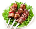 Grilled kebab (shashlik) on spits. Royalty Free Stock Photo