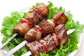 Grilled kebab (shashlik) on spits. Royalty Free Stock Photo