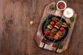Grilled kebabs with meat, mushrooms and vegetables