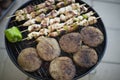 Grilled Kibbeh (Kebbeh) and shish taouk on the grill. BBQ (Barbecue) Royalty Free Stock Photo