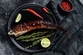 Grilled king klip, congrio with teriyaki sauce. Black background. Top view