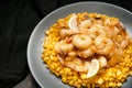 Grilled king prawns on dark plate