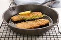 Grilled kipper with oat bran in a cast iron pan