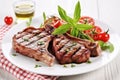 grilled lamb chops with herbs on a white plate Royalty Free Stock Photo