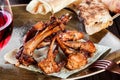 Grilled lamb chops with pita bread and glass of wine on a plate Royalty Free Stock Photo