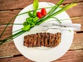 Grilled lamb fillet pieces on a plate with green Royalty Free Stock Photo