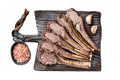 Grilled Lamb mutton Ribs Chops steaks on wooden board. Isolated on white background, top view. Royalty Free Stock Photo