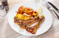 Grilled lamb rib chop steaks, medium rare with french fries on plate Royalty Free Stock Photo