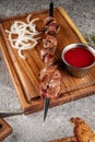 Grilled lamb shashlik with red sauce Royalty Free Stock Photo