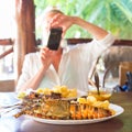 Grilled lobster served with potatoes and coconut sauce.