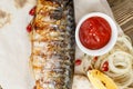 Grilled mackerel. Serving on a wooden Board on a rustic table. Barbecue restaurant menu, a series of photos of different Royalty Free Stock Photo